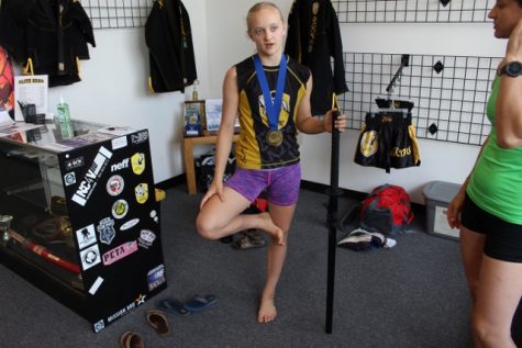 Terah Hieber with some of her awards; the sword is given to competition champions. (Port City Daily photo / BENJAMIN SCHACHTMAN)