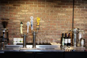 You'll find coffee, beer, and wine on tap at Crush and Grind. The cafe based wine bar aims to be the one stop shop for beverages on Carolina Beach. (Port City Daily photo/CORY MANNION)