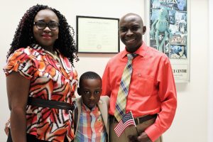 Franklin Etarock (R) pictured here with his wife Regina Ayamba (L) and son Francis (C). (Port City Daily photo/CORY MANNION)