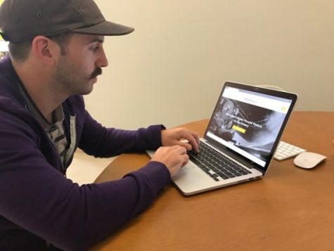 Rob Brink, a designer at Wide Open Tech, worked on the new Brewfully 'B2B' system. He also designed the labels for Wilmington Brewing Company's new canning release. The two industries seem to go together, Brink said. (Port City Daily photo / BENJAMIN SCHACHTMAN)
