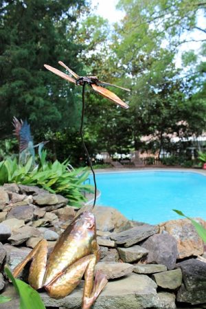 The home features many steel sculptures placed in a natural setting. Much of the work is done by local metal sculptor Paul Hill. (Port City Daily photo/CORY MANNION)