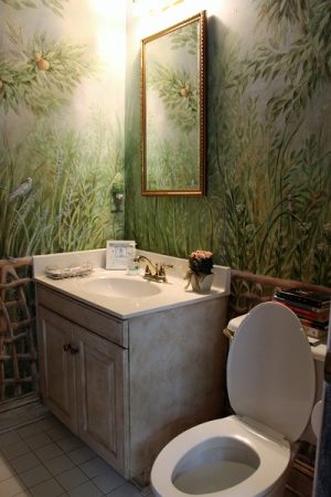 The bathroom in the "Pompeii" room is painted to look like a scene out of the "Jungle Book." Port City Daily photo/CORY MANNION)