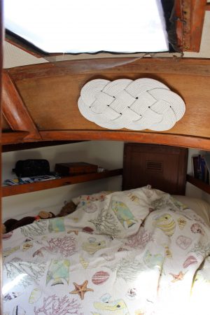 The main bunk is in the bow of the boat, giving it a distinct wedge shape. While at sea, the couple operates in three hour shifts, allowing the sleeper to maximize their legroom in the bedroom and stretch out. (Port City Daily photo/CORY MANNION)
