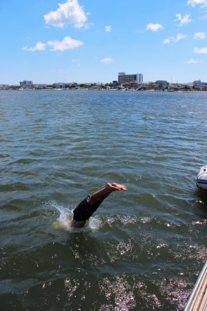 Anthony Tatum demonstrates the proper way to cool off at sea. (Port City Daily photo/CORY MANNION)