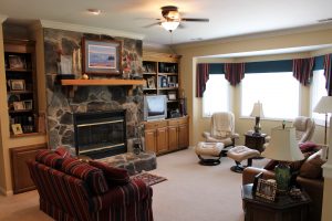 “Another thing people in Wilmington don’t have is a fireplace. And it’s an inside fireplace, because our bedroom is right behind it. I’ll tell you what it is, it’s just wonderful. We love fire, and I don’t have gas, I burn real wood, because I’m a man,” he said laughing. (Port City Daily photo/CORY MANNION)