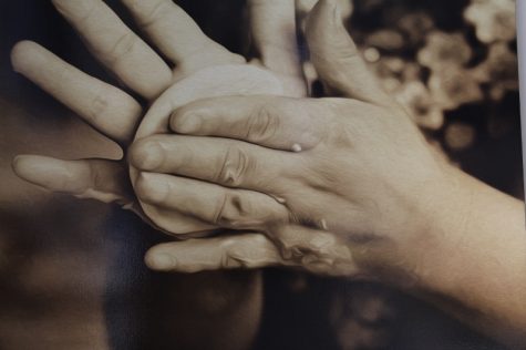 Masa being worked into a sope - like a cross between a think tortilla and a dumpling - adorns one wall. "Sopes are - I can't even describe them - they're just so good," Alejandro Herndanez said of a childhood favorite. (Port City Daily photo / BENJAMIN SCHACHTMAN)