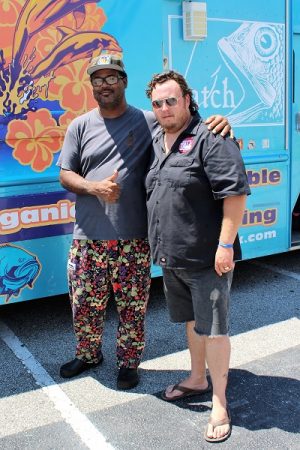 Chef Keith Rhodes of "Catch Fresh Seafood Restaurant," and brought out "Catch the Food Truck" to donate his talent to the efforts of Walking Tall. Pictured: Keith Rhodes (L), and Randy Evans (R). (Port City Daily photo/CORY MANNION)
