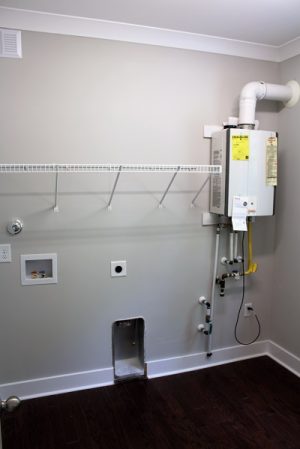 The tankless water heater runs off of a propane system, which only activates when you run hot water. Beatty says this helps make the home extremely energy efficient. (Port City Daily photo/CORY MANNION)