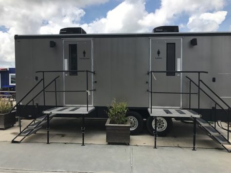 One of the temporary public bathrooms, currently sitting on private property. Developer Chuck Schoninger said New Hanover County's permitting process was responsible for delays in installing the bathrooms for public use. (Port City Daily photo / BENJAMIN SCHACHTMAN)
