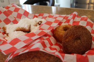 A fresh batch of Brooklyn Café staples, beignets and potato doughnuts. (Port City Daily photo/CORY MANNION)