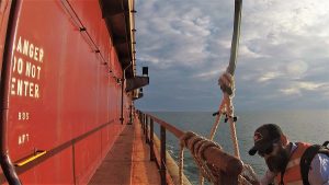 McNeill begins to disembark the vessel. (Port City Daily photo/CORY MANNION)