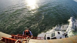 In rough seas, this could be a perilous descent, luckily, the waters were calm. (Port City Daily photo/CORY MANNION)