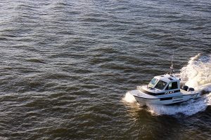 A Southport river pilot comes to pick McNeill up at the end of the journey. (Port City Daily photo/CORY MANNION)