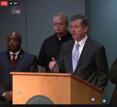 Governor Roy Cooper (right) with Emergency Management Director Mike Sprayberry behind him. (Port City Daily photo / COURTESY GOVERNOR ROY COOPER)