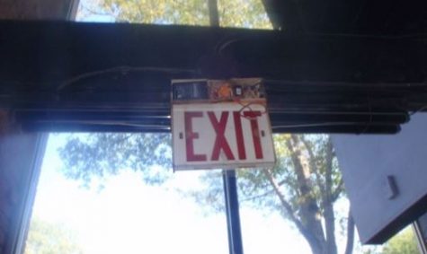 Damaged exit lights at the Blue Eyed Muse were among numerous safety and structural issues identified by a private inspection. (Port City Daily photo / COURTESY WILMINGTON INSPECTION GROUP)