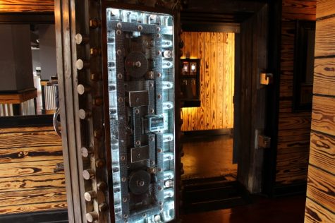 The original 1920s bank vault from Murchinson Building has been turned into a wine room, featuring four whites and four reds on tap. 