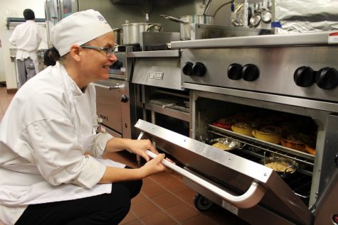 Chef and Instructor Gwen Gulliksen admiring the students' cassoulet. (Port City Daily photo / BENJAMIN SCHACHTMAN)