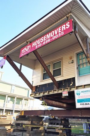 This Carolina Beach beach cottage on 700 Canal Drive, built in 1928, will eventually get elevated to 24-feet off the ground to allow builders to install a downstairs apartment and mitigate flood risk, with funding granted by FEMA. (Port City Daily photo/ JOHANNA FEREBEE)