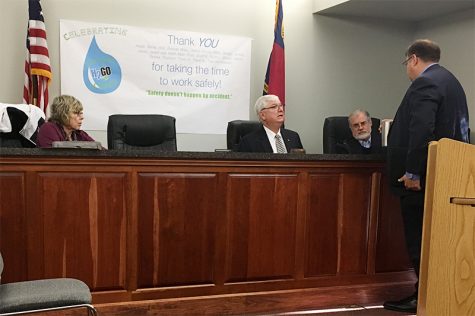 H2Go Commissioners Trudy Trombley (left), Bill Beer and Jeff Gerken consult with Stephen Coble, H2Go's general counsel after passing a resolution that reverses the sale of its assets to Belville. (Port City Daily photo / JOHANNA FEREBEE)