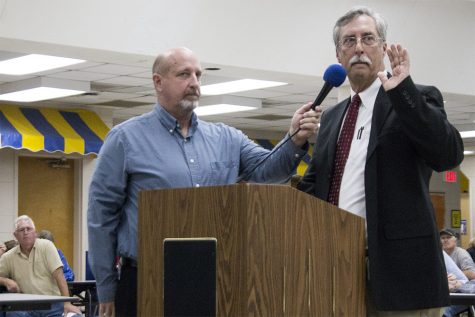 H2GO director Bob Walker swears in newly-elected commissioner Rodney McCoy Dec. 19. Re-elected commissioner Ron Jenkins was also sworn in and newly-elected Beer had been sowrn in earlier this month. (Port City Daily photo / JOHANNA FEREBEE)