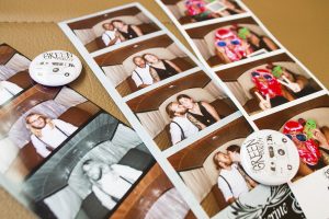 In the Little Green Booth, partygoers can pile in, throw on a goofy prop, and have printed out 2 by 6 or 2 by 4 photo strips within seconds. (Port City Daily photo /JOHANNA FEREBEE)