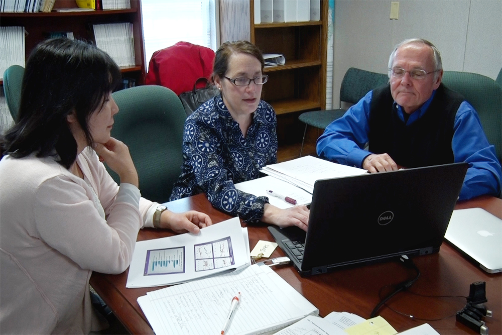 Satomi Imai, Katherine Jones and Dr. Chris Mansfield review research results produced in East Carolina University's study,&nbsp; "Increased Mortality and Health Risk Behaviors of Midlife White North Carolinians: A Marked Contrast to Nonwhites."(Port City Daily photo /COURTESY EAST CAROLINA UNIVERSITY)