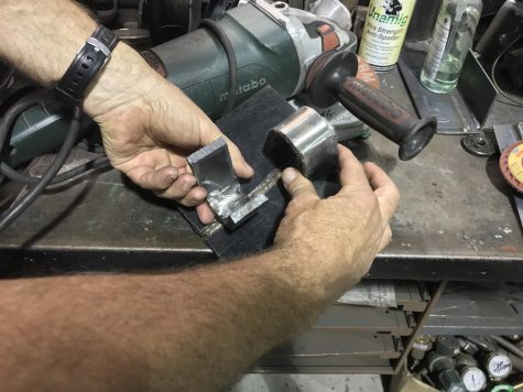 Sections of student welds are cut out and subjected to intense 180-degree bends. As Program Director Mike Taylor said, 'If your weld ever had to endure that, it would mean the apocalypse had come – but it’s a surefire way to know it’s a good weld.' (Port City Daily photo | BENJAMIN SCHACHTMAN)