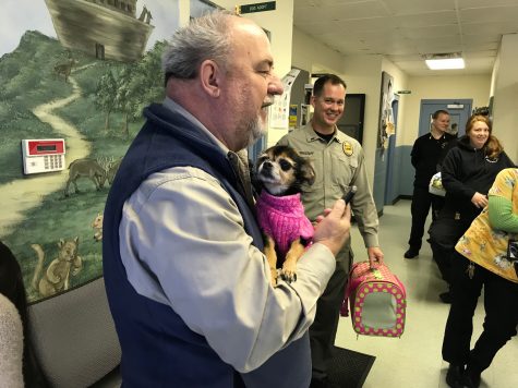 New Hanover County Animal Services reunites Gelson Cardoso with Princess, who went missing from his daugher's Miami-area house almost two years ago. (Port City Daily photo | BENJAMIN SCHACHTMAN)
