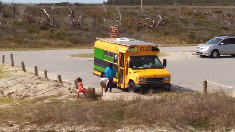 The Zwart family's modified school bus, complete with solar panels, on an earlier visit to Fort Fisher. (Port City Daily photo | COURTESY JOHAN ZWART)