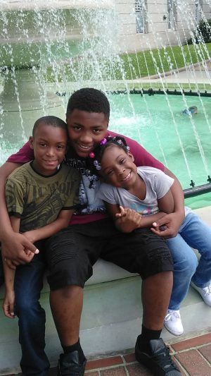 WPD is searching for Malik Nixon (center), 14, who has been missing since Friday morning. (Port City Daily photo/Courtesy of Wilmington Police Department)