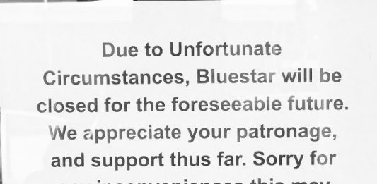 Appearing overnight in the window at Bluestar Kitchen Bar in Leland, this note indicated the restaurant was 'closed for the foreseeable future.' (Port City Daily photo | Benjamin Schachtman)