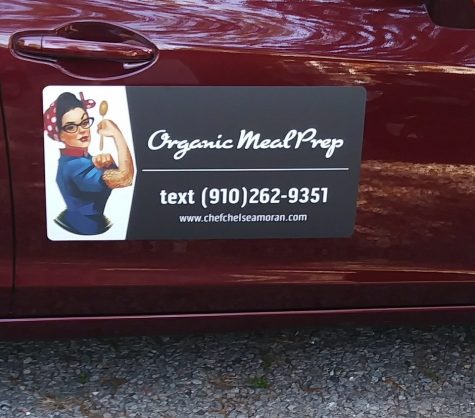 Chef Chelsea Moran wants to cook in your kitchen, and she's got the logo-stamped car door to prove it. (Port City Daily photo | Chelsea Moran)