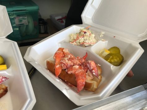 Tony Herndon’s lobster rolls come with pineapple coleslaw, pickles, and a lot lobster, which might be the secret to his success. (Port City Daily photo |Benjamin Schachtman)