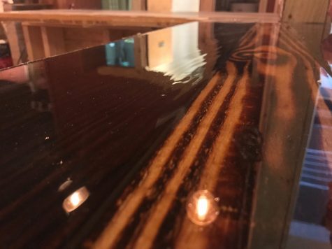 Axes & Allies' Shou Sugi Ban bar, created by Nick Williams, involved blow-torching wood, shaving the char off, and finishing it. (Port City Daily photo | Benjamin Schachtman)