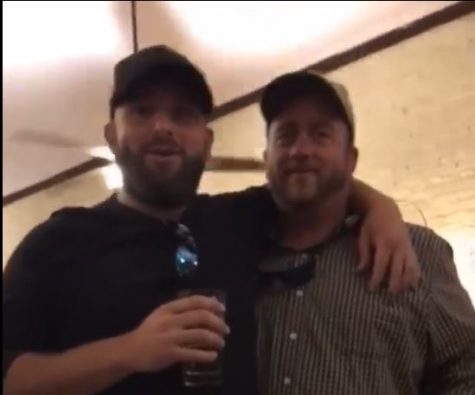 A still from the video posted by Chris Parker. The man on the left is apparently a Pender County Sheriff's deputy. (Port City Daily photo | Courtesy Facebook)