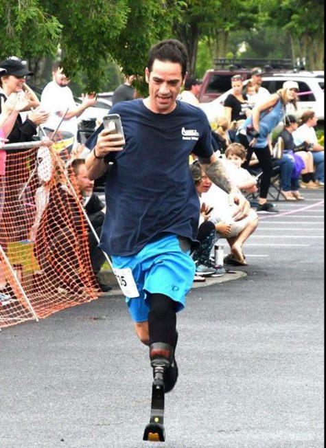 Marc Dunshee competing in a recent race wearing the Eco TEK industries prototype hemp-based prosthetic. (Port City Daily photo | Courtesy Kyle Trivisonno)