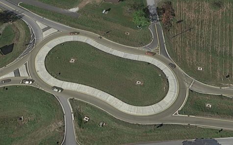 The roundabout at the intersection of Castle Hayne and North College roads. (Port City Daily photo | Courtesy Google Maps)