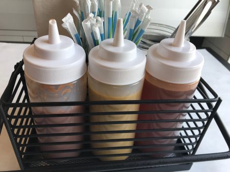 Skytown won't end the decades-old debate over which barbecue sauce is the best, but it will let you take your pick: "West," tomato-based, "East" vinegar-based, and "South" mustard-based sauces. Not pictured, but available on request, "Deep South" Alabama-style white sauce made with mayo and vinegar. (Port City Daily photo | Benjamin Schachtman)