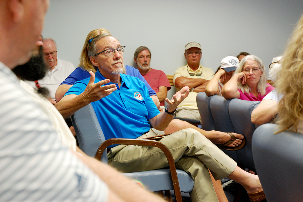 Kure Beach mayor Craig Blozsinksky asks MOTSU Col. Marc Mueller a question during a public meeting. (Port City Daily photo/Johanna Ferebee)