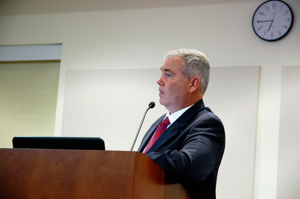 Leland's town manager David Hollis presents the final version of a flood study report before Council. (Port City Daily photo/Johanna Ferebee)
