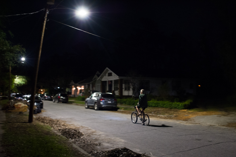 The fall colors of Halloween gave way to spooky, narrow streets as a near-full moon rose above Carolina Place Tuesday night. (Port City Daily photo / Mark Darrough)