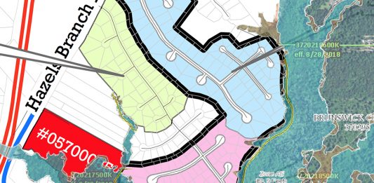 A new subdivision, shown in red, is being proposed in Leland. It's adjacent to Stoney Creek, shown in Pink, a neighborhood that experienced severe flooding during Hurricane Florence last month. Some areas of the subdivision are located in the floodplain. (Port City Daily graphic/Johanna Ferebee, Source: Federal Emergency Management Agency, Town of Leland)