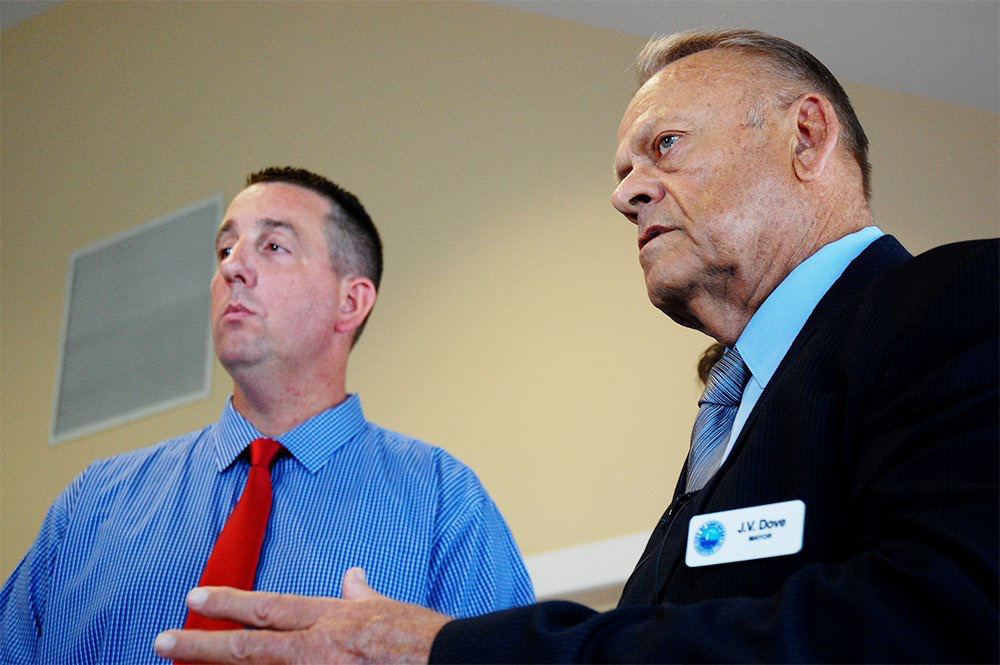 Former Board of Alderman, and new Southport Police Chief Todd Coring (left) and Mayor Jerry Dove address the press in July, hours after the town's police chief and second-in-command were arrested after a joint SBI and FBI investigation. (Port City Daily photo/Johanna Ferebee) 