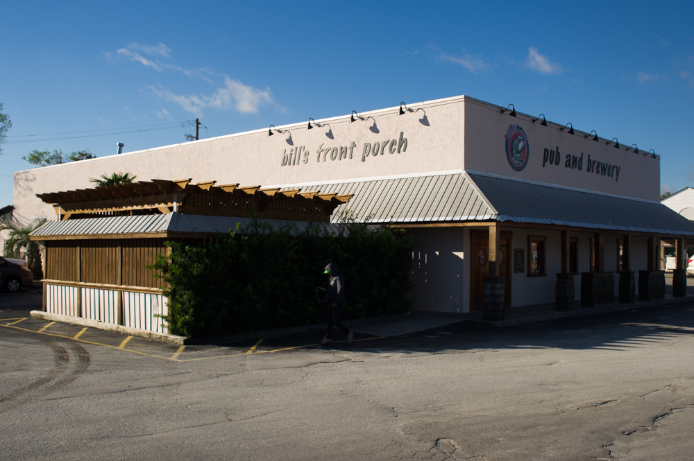 The current 7-barrel brew house sits beside the restaurant and bar of Bill's Front Porch. The new building, which will include a 20-barrel brew house and a new taproom, is located just behind the restaurant on Cinema Drive. (Port City Daily photo/Mark Darrough)