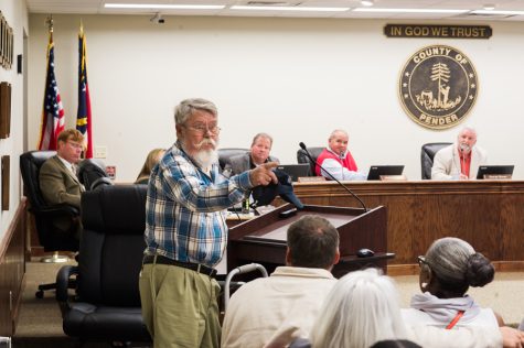 Lifetime Pender County resident Burton Chadwick, 72, took to the podium first Monday night. “You county commissioners have two choices: either you can get the trash removed or you can resign for not doing your job,” Chadwick said. (Port City Daily photo/Mark Darrough)
