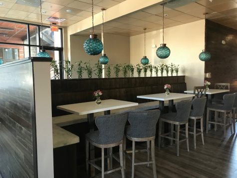 Inside, hightops and bench seating opposite the bar are relaxed and uncramped. (Port City Daily photo / Benjamin Schachtman)