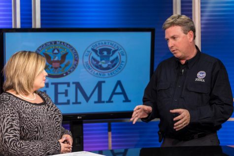 FEMA spokesman John Mills talks with a television reporter in southwestern Georgia after severe storms affected the region in January 2017. (Port City Daily photo/Courtesy FEMA)