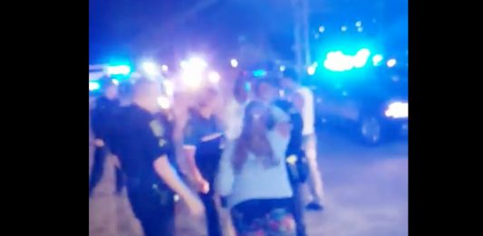 An incident involving the arrest of a mentally ill individual being involuntarily committed was filmed by bystanders Tuesday evening. (Port City Daily photo/Courtesy Christopher Farmer)