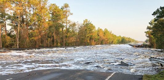 During Hurricane Florence, flooded waters from Fishing Creek, a tributary of the Cape Fear River, washed out a four-lane portion of road on Highway 421 north of Wilmington. (Port City Daily photo/Courtesy North Carolina Department of Transportation)