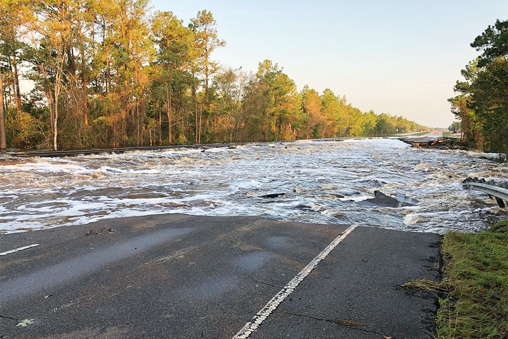 During Hurricane Florence, flooded waters from Fishing Creek, a tributary of the Cape Fear River, washed out a four-lane portion of road on Highway 421 north of Wilmington. (Port City Daily photo/Courtesy North Carolina Department of Transportation)
